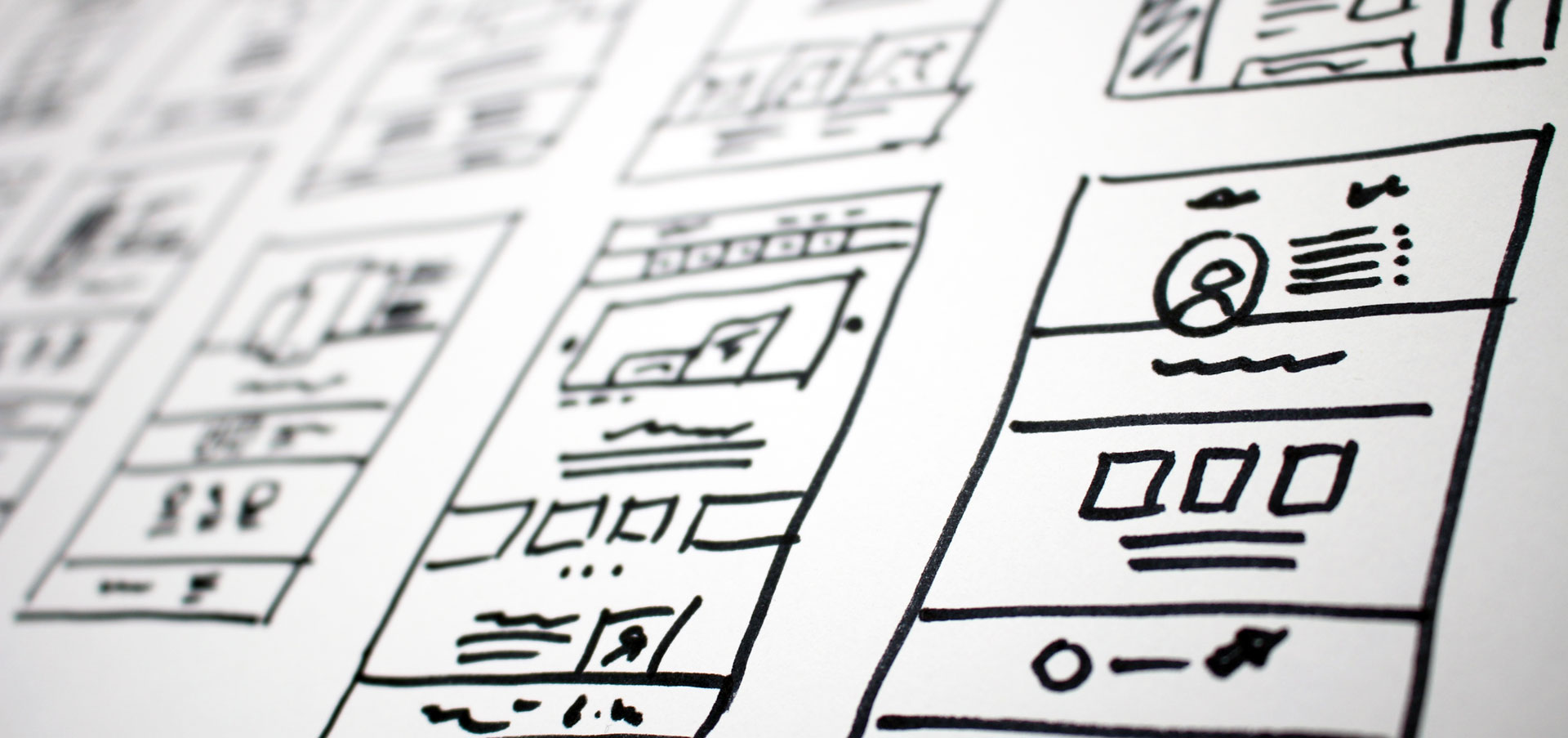 Wire-framing on a whiteboard after a website audit has been performed